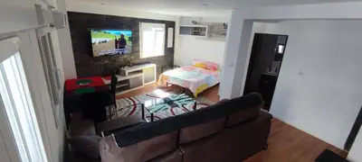 Una televisión o centro de entretenimiento en Apartamento cerca Plaza Pilar