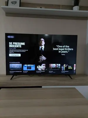 Una televisión o centro de entretenimiento en Apartamento en Formigal - Parking Privado Incluido