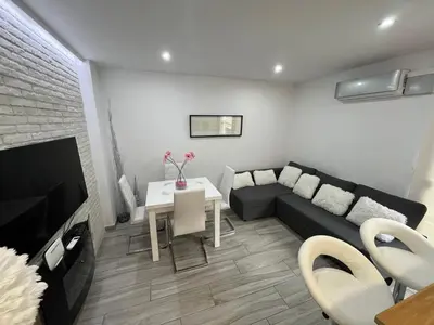 Una televisión o centro de entretenimiento en Apartamento premium Aínsa