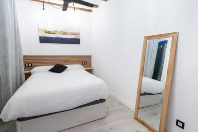 Cama o camas de una habitación en Encantador apartamento en el corazón de Pamplona