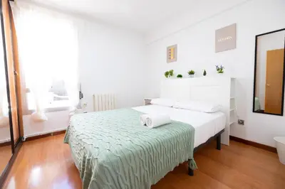 Cama o camas de una habitación en Ofrenda del Pilar Turistea