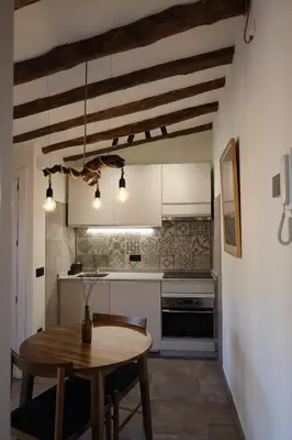 Una cocina o zona de cocina en Ático con terraza en Capçanes