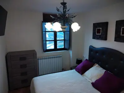 Cama o camas de una habitación en Ibón de Estanés Apartamento en Formigal