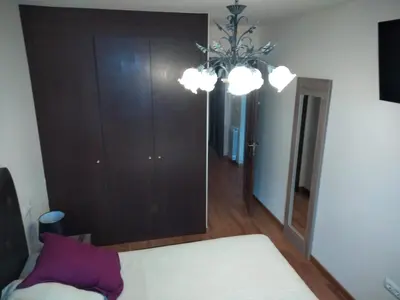 Cama o camas de una habitación en Ibón de Estanés Apartamento en Formigal
