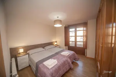 Cama o camas de una habitación en Apartamento Pradas Jaca