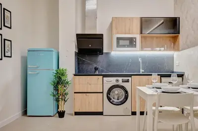 Una cocina o zona de cocina en Apartamentos Panda by Clabao