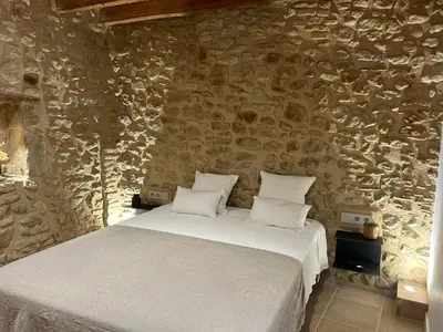 Cama o camas de una habitación en CAL PASSACOSTES cb