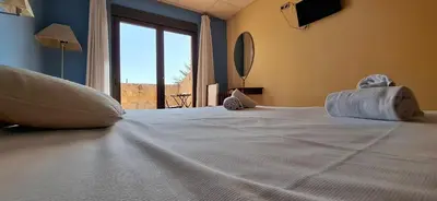 Cama o camas de una habitación en Hotel Villa de Estercuel