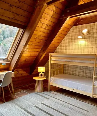 Cama o camas de una habitación en SNÖ Apartamentos Escarrilla