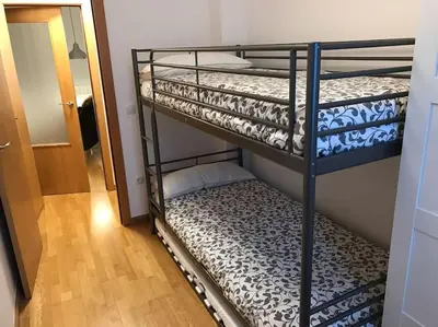 Cama o camas de una habitación en Apartamento la Abadía en Tramacastilla