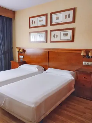 Cama o camas de una habitación en Hostal Los Infantes