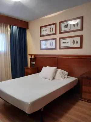 Cama o camas de una habitación en Hostal Los Infantes