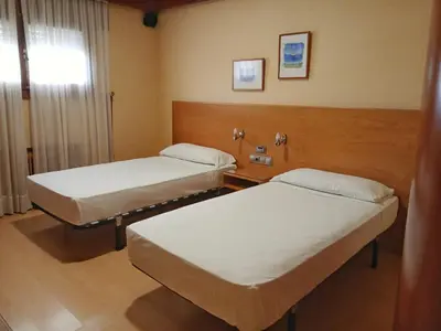 Cama o camas de una habitación en Hostal Los Infantes