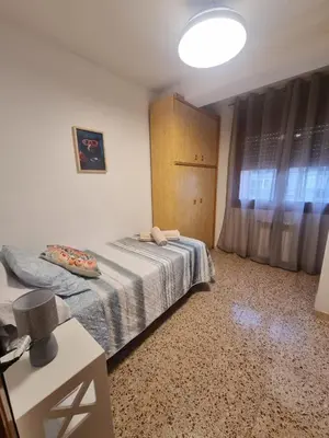 Cama o camas de una habitación en Amani Apartamento Alcañiz