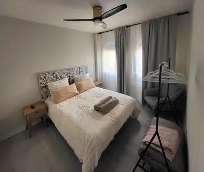 Cama o camas de una habitación en Apartamentos Crispín Candela