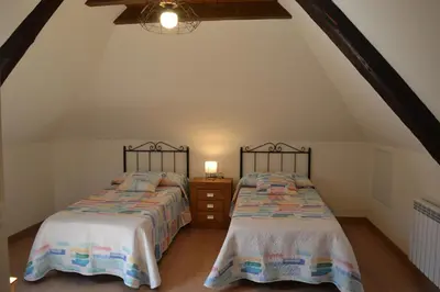 Cama o camas de una habitación en Alojamientos Rurales Apezarena