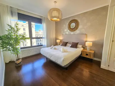Cama o camas de una habitación en Apartamentos Zaragoza Independencia 3000