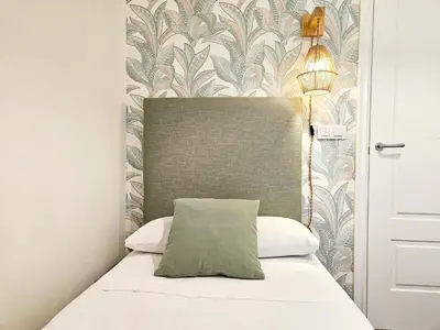 Cama o camas de una habitación en Apartamentos Zaragoza Independencia 3000