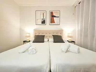 Cama o camas de una habitación en Apartamentos Zaragoza Independencia 3000
