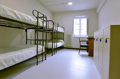 Cama o camas de una habitación en Albergue Capuchinos Rocamador