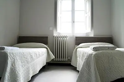 Cama o camas de una habitación en Albergue Capuchinos Rocamador