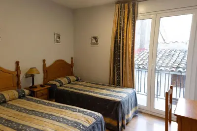 Cama o camas de una habitación en Pensión El Gallo