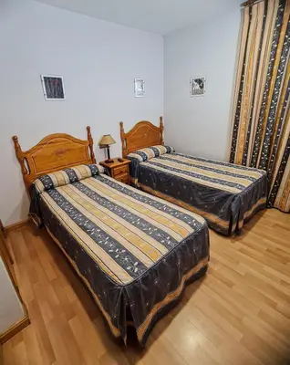 Cama o camas de una habitación en Pensión El Gallo