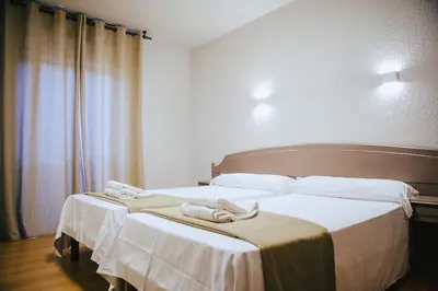 Cama o camas de una habitación en Hotel&Bar Ducay