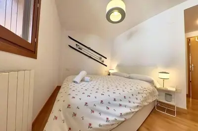 Cama o camas de una habitación en Pondiellos 42 - tucasaenlospirineos
