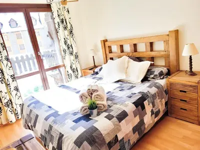 Cama o camas de una habitación en Cómodo y Soleado apartamento en Panticosa
