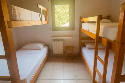 Cama o camas de una habitación en Albergue La Escuela de Liri