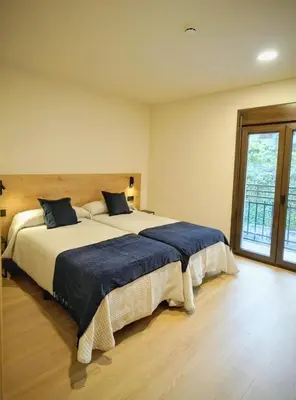 Cama o camas de una habitación en Hotel Casa Peix