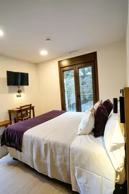 Cama o camas de una habitación en Hotel Casa Peix