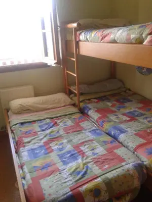 Cama o camas de una habitación en Formigal Edificio Aries