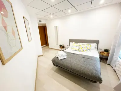 Cama o camas de una habitación en Novedad Avenida puente del Pilar