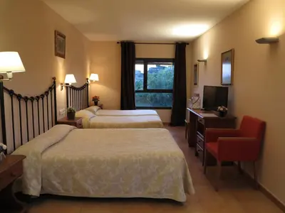 Cama o camas de una habitación en Hotel Era Conte