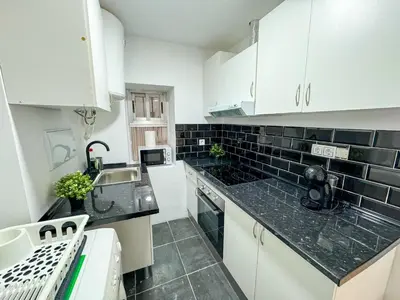 Una cocina o zona de cocina en Madrina del Pilar - Turistea
