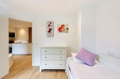 Cama o camas de una habitación en Clínica Universitaria y Hospitales by Clabao