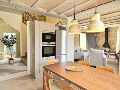 Una cocina o zona de cocina en Casa Rural Cal Roseto con jacuzzi