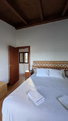 Cama o camas de una habitación en La Casa del Lago con vistas a las Montañas
