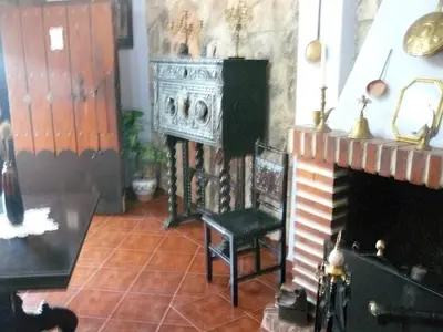 Una televisión o centro de entretenimiento en Vivienda Principal Torre de Campos