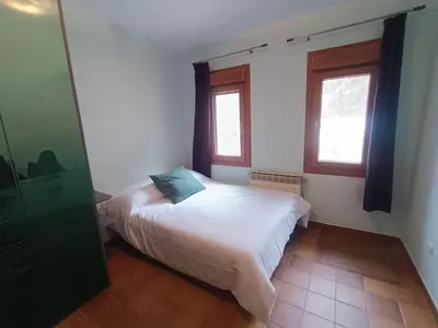 Cama o camas de una habitación en Casa Rural en Valmuel El Arquero