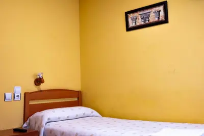 Cama o camas de una habitación en Pensión Discoves