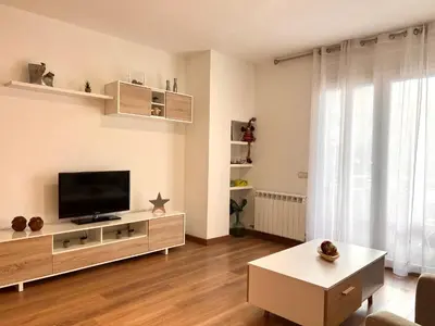 Una televisión o centro de entretenimiento en Apartament Escapat Sort - L'Amfitriona