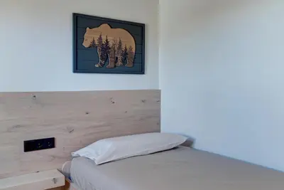 Cama o camas de una habitación en Tanau-Rentals El Oso