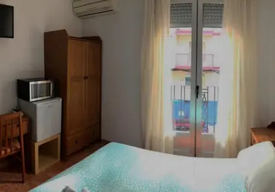 Cama o camas de una habitación en Pensión Fortea