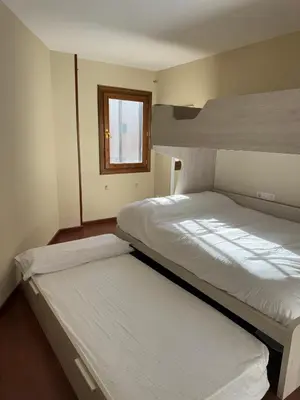 Cama o camas de una habitación en Céntrico apartamento con vistas en Formigal - Entrada 24h sin llaves
