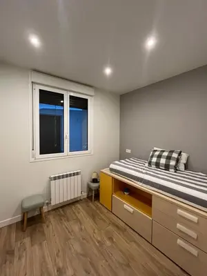 Cama o camas de una habitación en En el corazón de Pamplona