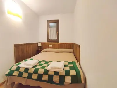 Cama o camas de una habitación en Homenfun Baqueira Beret Vielha III