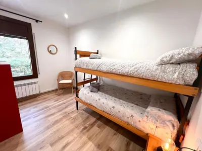 Cama o camas de una habitación en Apartaments Casa Mata - L'Amfitriona